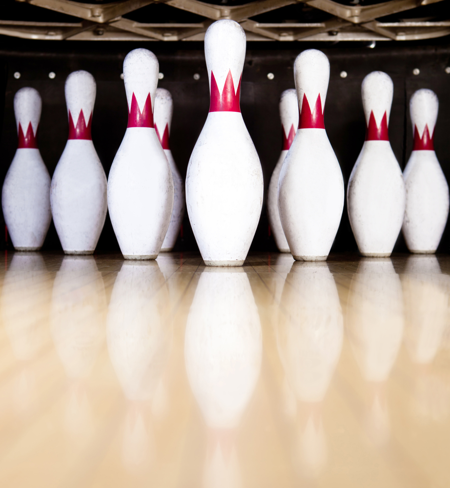 Ten white pins in a bowling alley