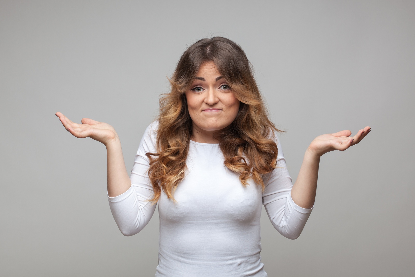 bigstock-Shrugging-woman-in-doubt-doing-65627377.jpg