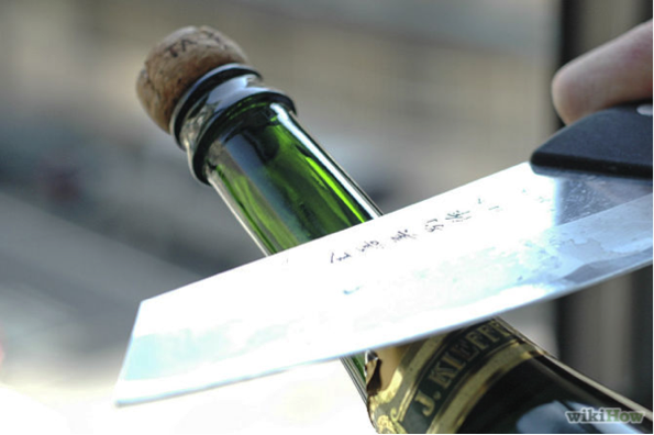 Open champagne with a knife