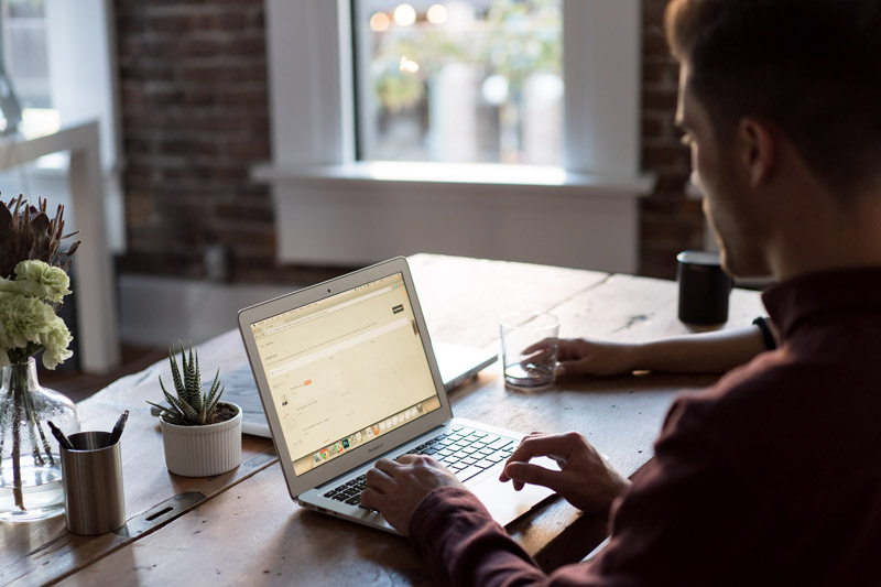 person using laptop at a desk