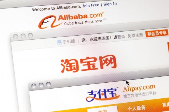 Alibaba Group Holding Ltd.'s websites Alibaba.com, from top, Taobao.com and Alipay.com are arranged on a computer in Shenyang, Liaoning Province, China, on Wednesday, May 23, 2012. Alibaba, who agreed to repurchase about half of Yahoo Inc.'s stake in itself, may borrow as much as $2 billion from China Development Bank Corp. and another $2 billion from a syndicate of international lenders, according to two people familiar with the matter. Photographer: Nelson Ching/Bloomberg