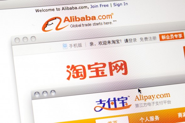 Alibaba Group Holding Ltd.'s websites Alibaba.com, from top, Taobao.com and Alipay.com are arranged on a computer in Shenyang, Liaoning Province, China, on Wednesday, May 23, 2012. Alibaba, who agreed to repurchase about half of Yahoo Inc.'s stake in itself, may borrow as much as $2 billion from China Development Bank Corp. and another $2 billion from a syndicate of international lenders, according to two people familiar with the matter. Photographer: Nelson Ching/Bloomberg