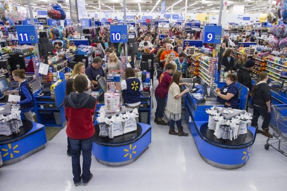 Customers wrap up their holiday shopping during Walmart's Black Friday events on Thursday November 27, 2014 in Bentonville, Ark. Deep savings continue at Walmart Friday though Cyber Monday as part of five days of events in stores and online. (Photo by Gunnar Rathbun/Invision for Walmart/AP Images)