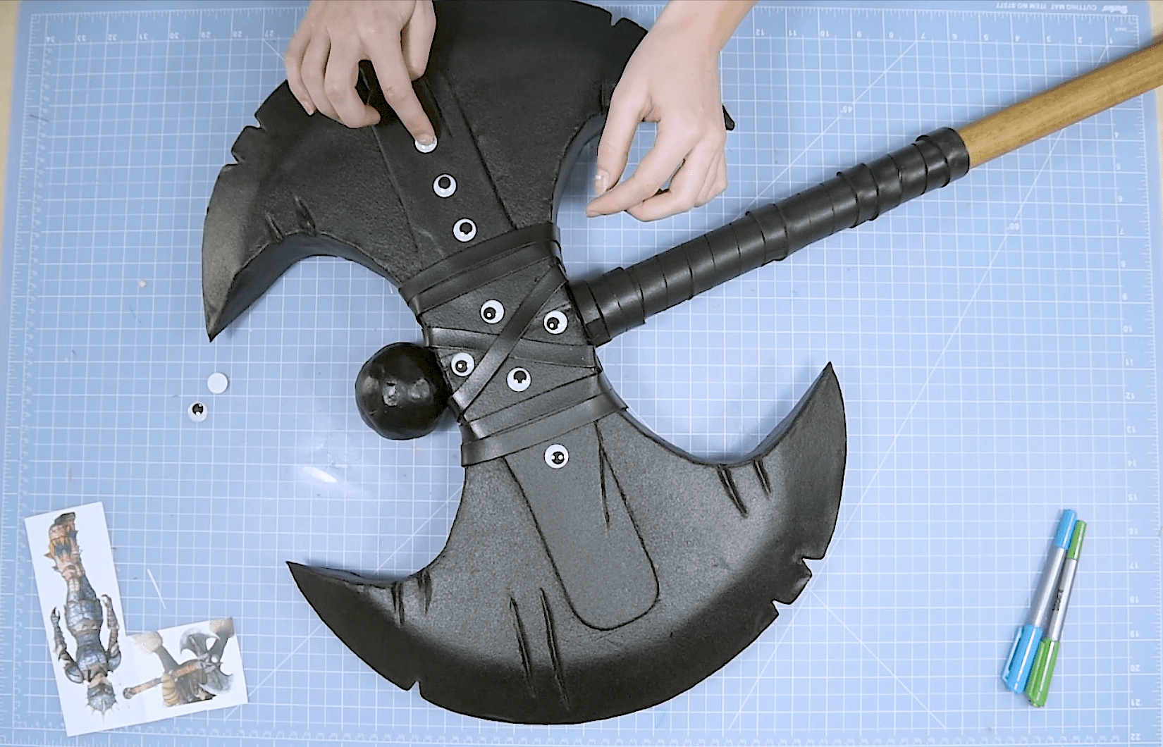 Attaching googly eye screw head details to Astrid's axe cosplay weapon