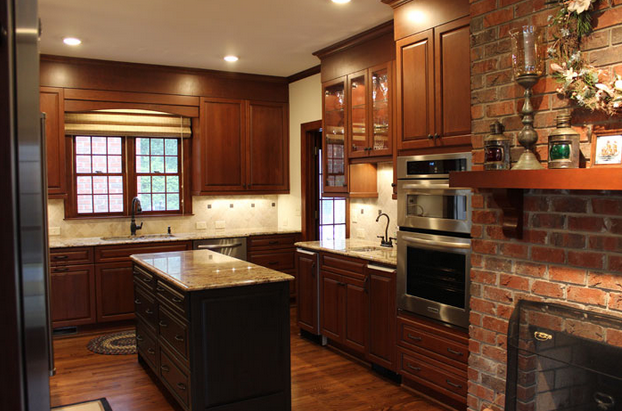 The kitchen now features a fireplace. The room has become a gathering spot for guests.