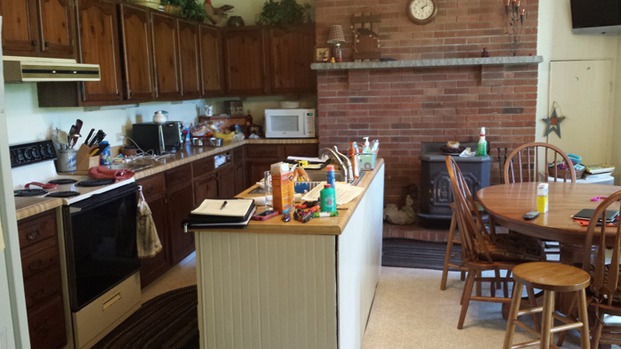 Before the remodel, the kitchen was dark and dated.