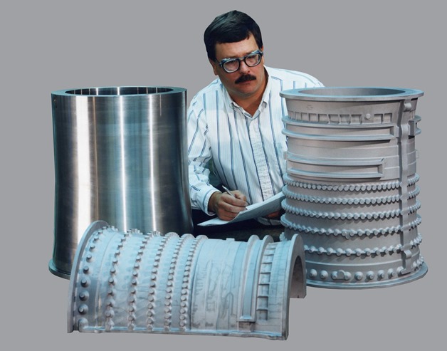 Man inspecting stainless steel products
