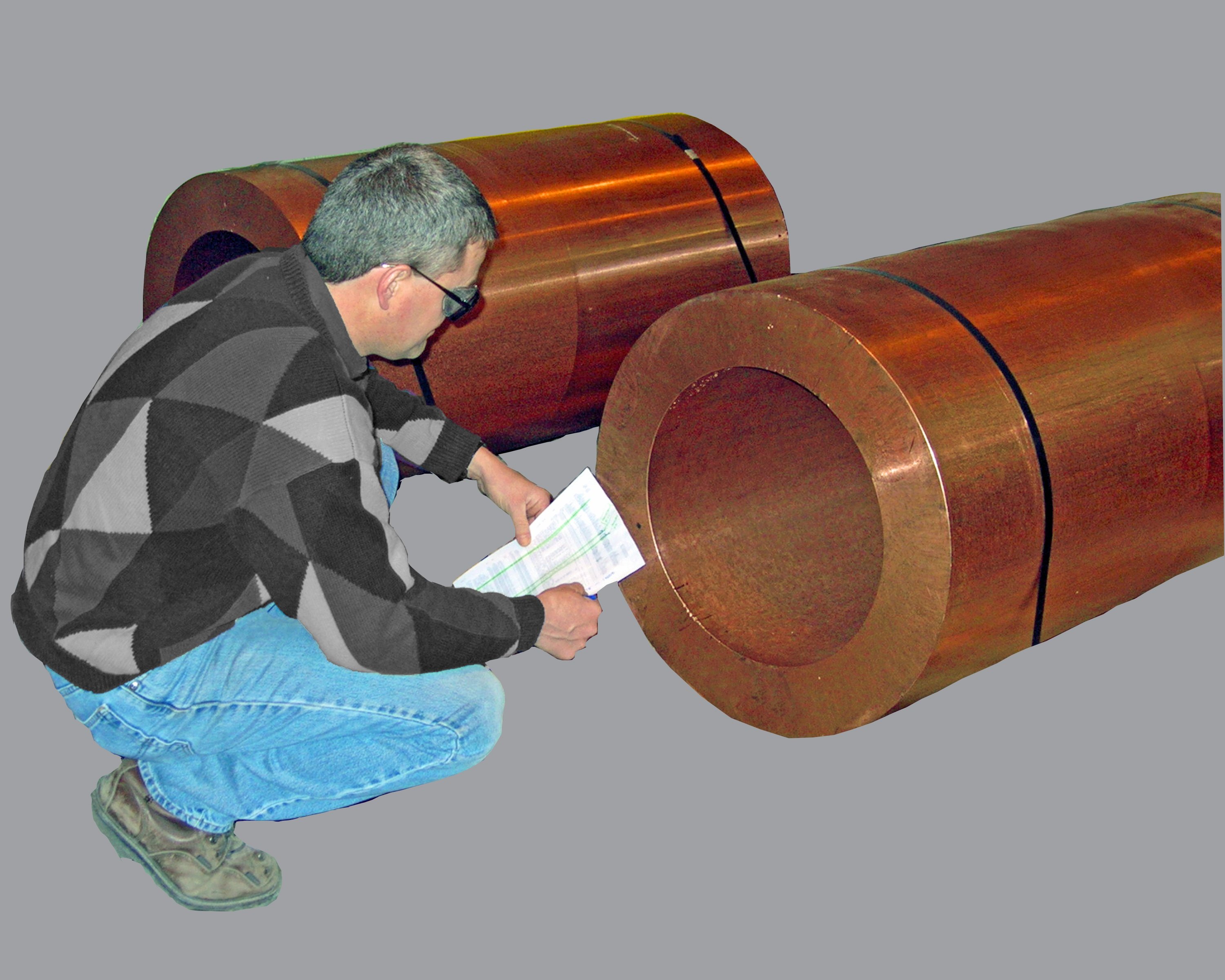 Man inspecting a copper casting