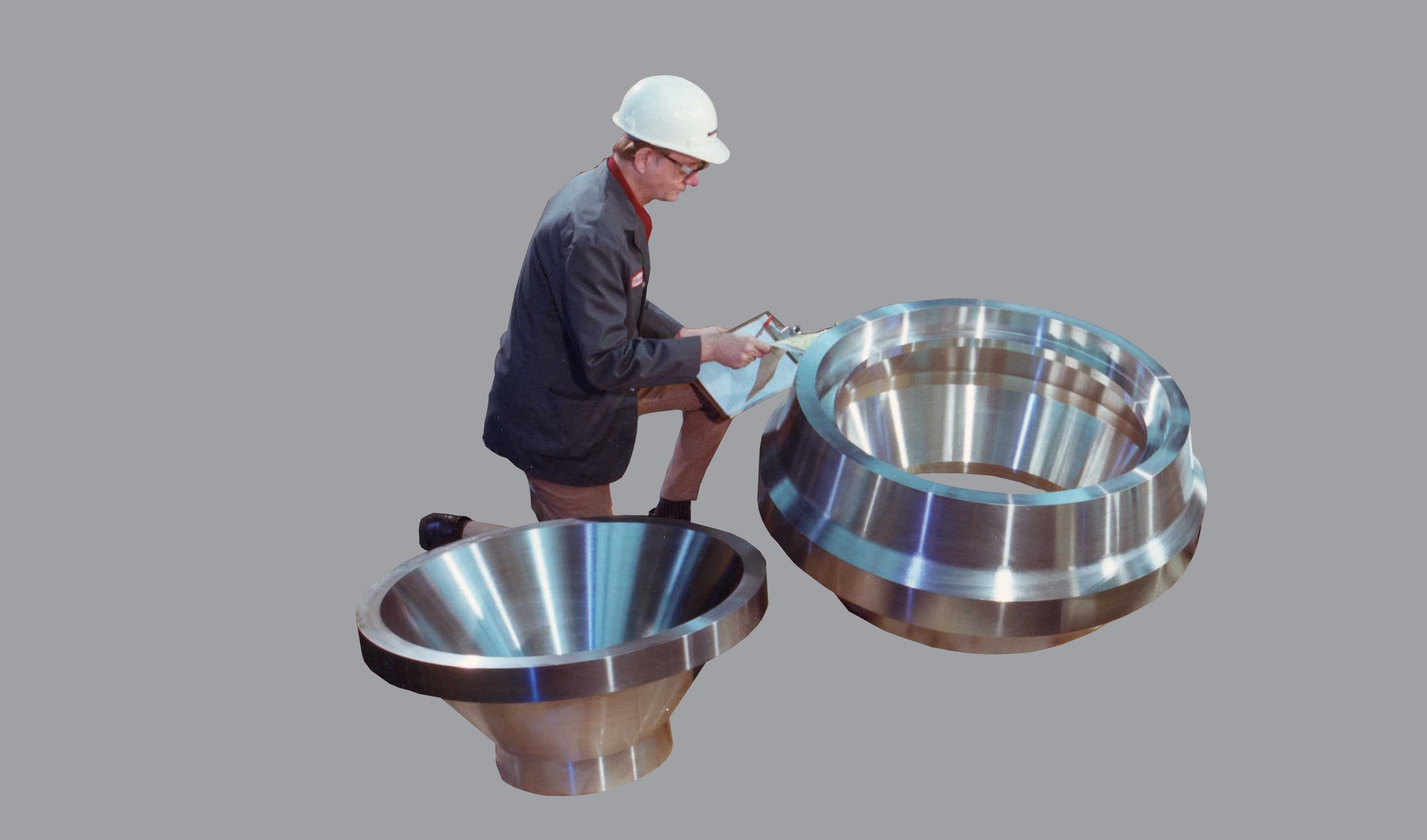 Man inspecting stainless steel product