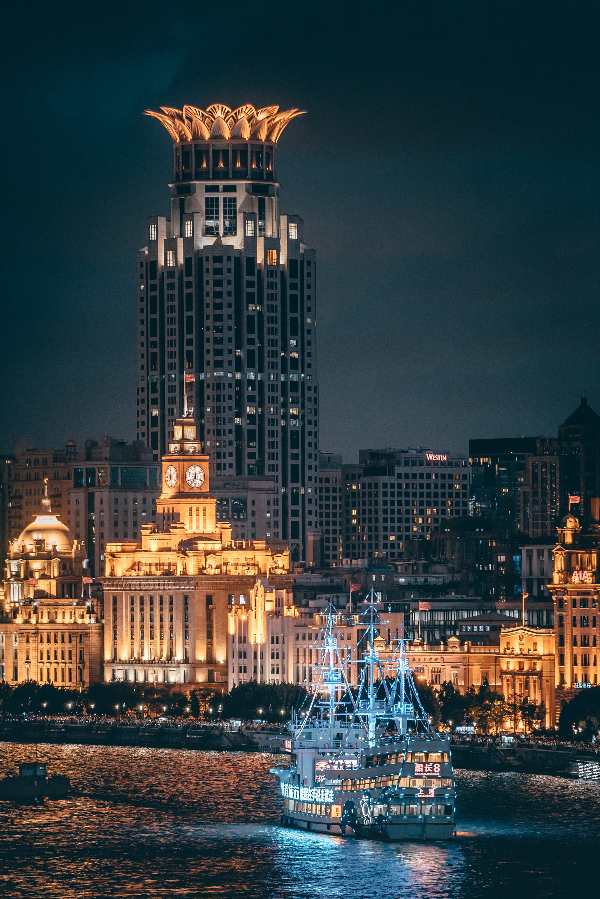 View Of A Boat Cruising The Huangpu River And The Bund