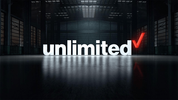 the word 'unlimited' lit up in the middle of a warehouse
