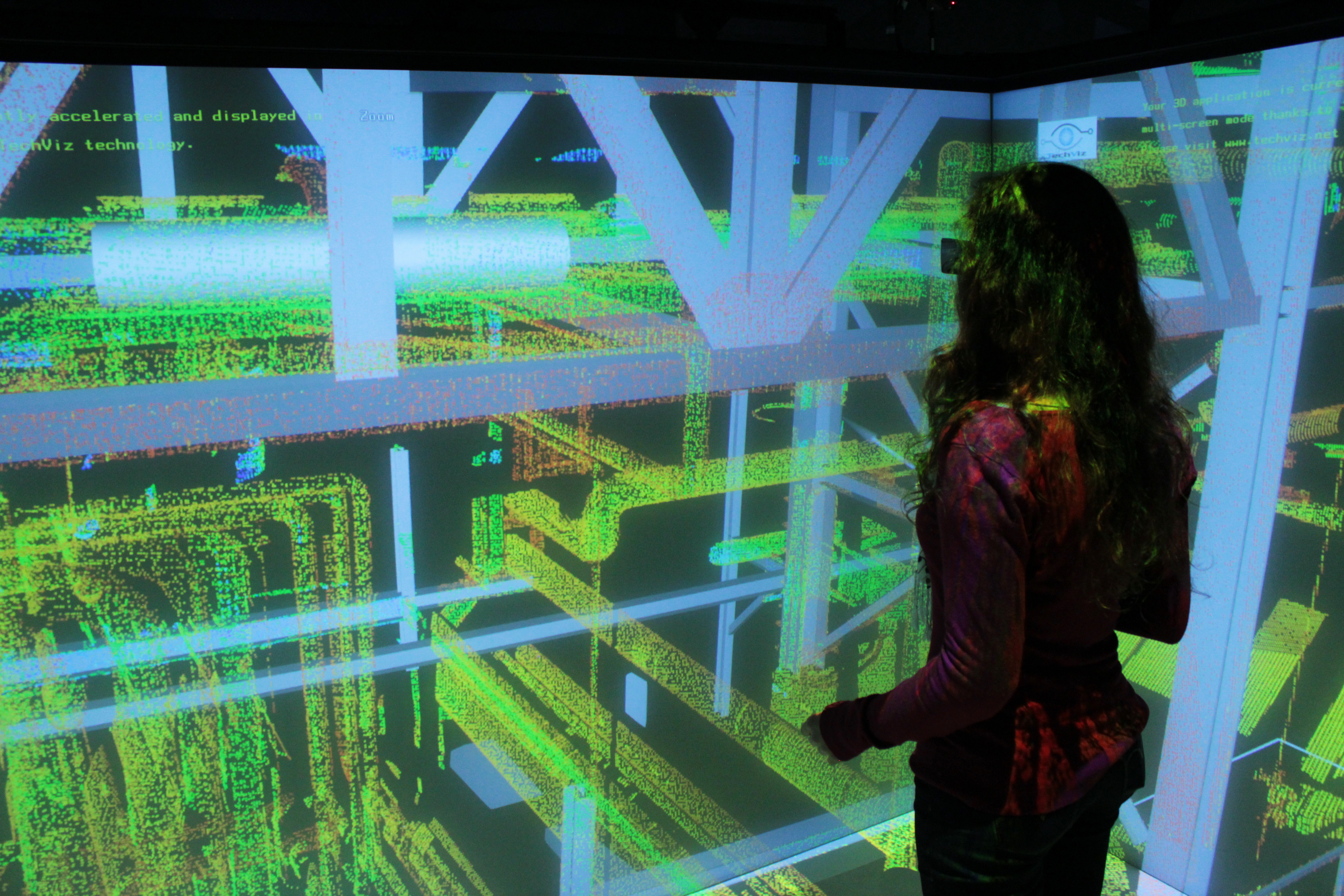 woman examining a 3D point cloud in VR