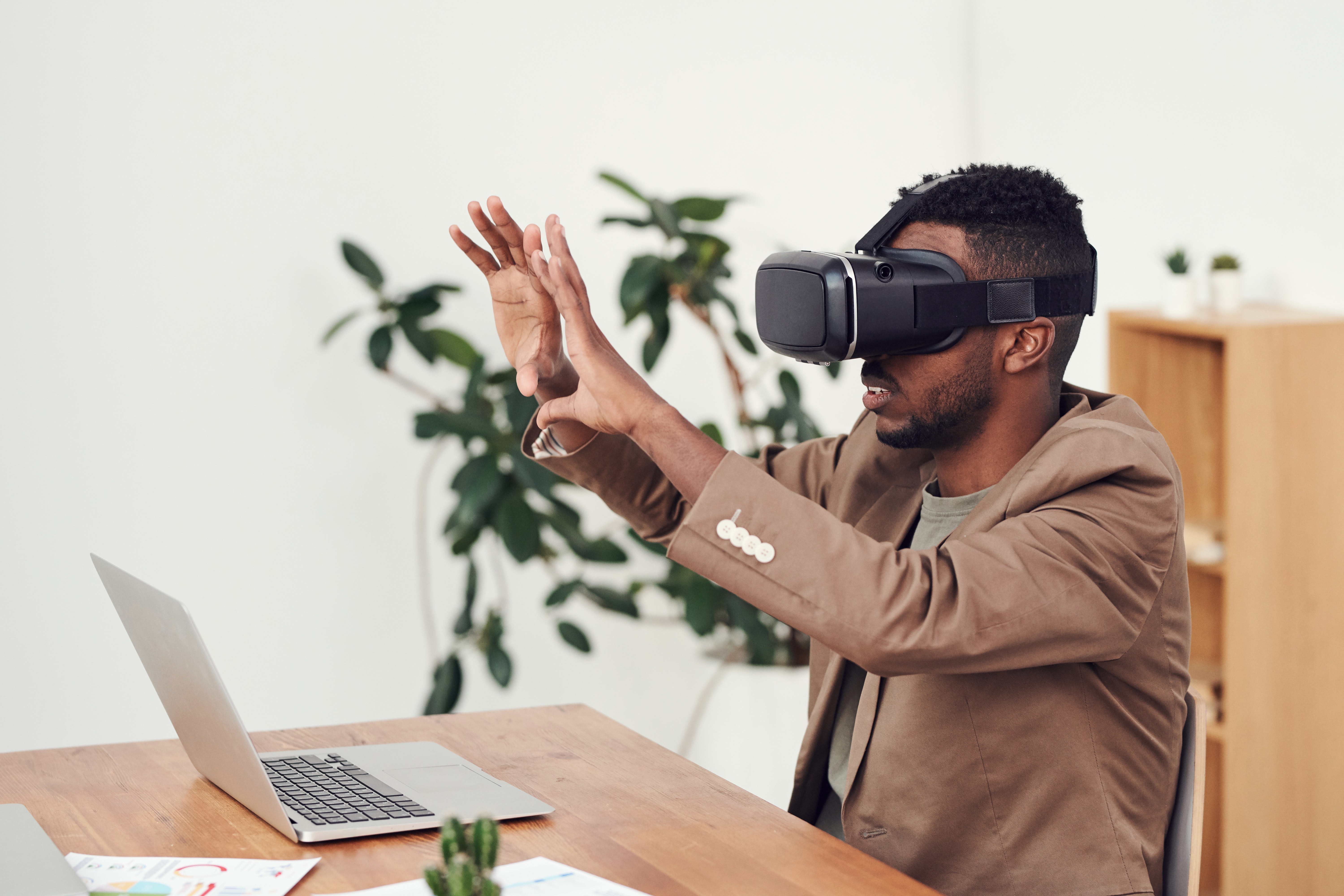 man reviewing his CAD model in VR with a HMD