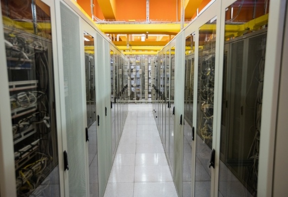 Hallway with a row of servers in server room-1-984604-edited.jpeg