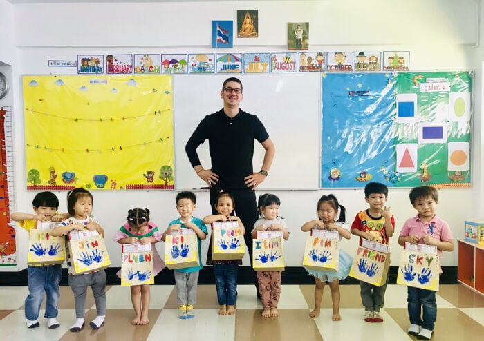 English teacher Christian Lopez teaching English in Bangkok, Thailand with his students