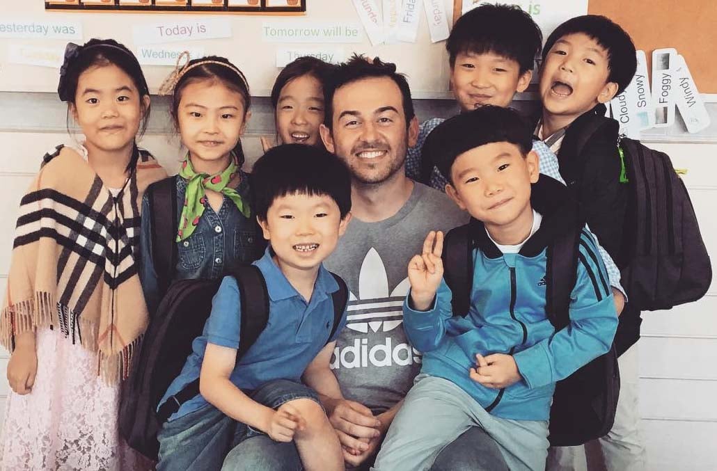 ITA graduate & English teacher KJ Schultz in South Korea with his students