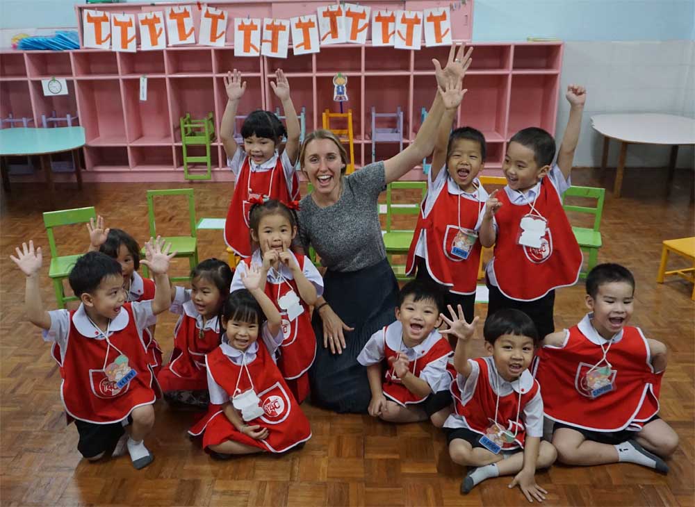 ESL teacher Summer Schlageter in Chiang Mai, Thailand with her students