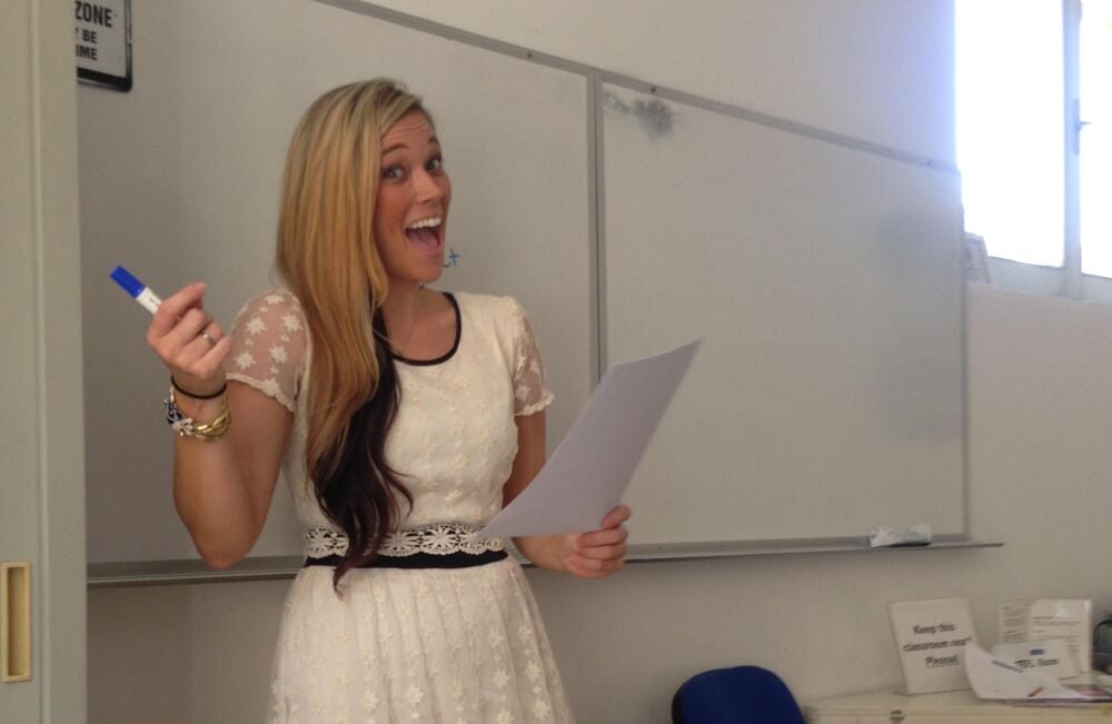 a female English teacher in Italy in her classroom