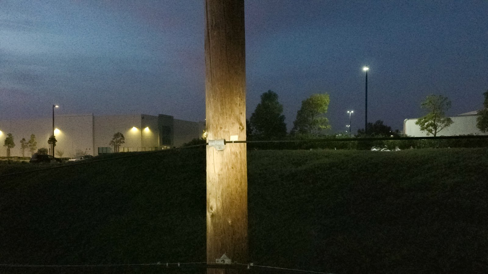 Powerline pole is lit with D3060 drone light for inspection