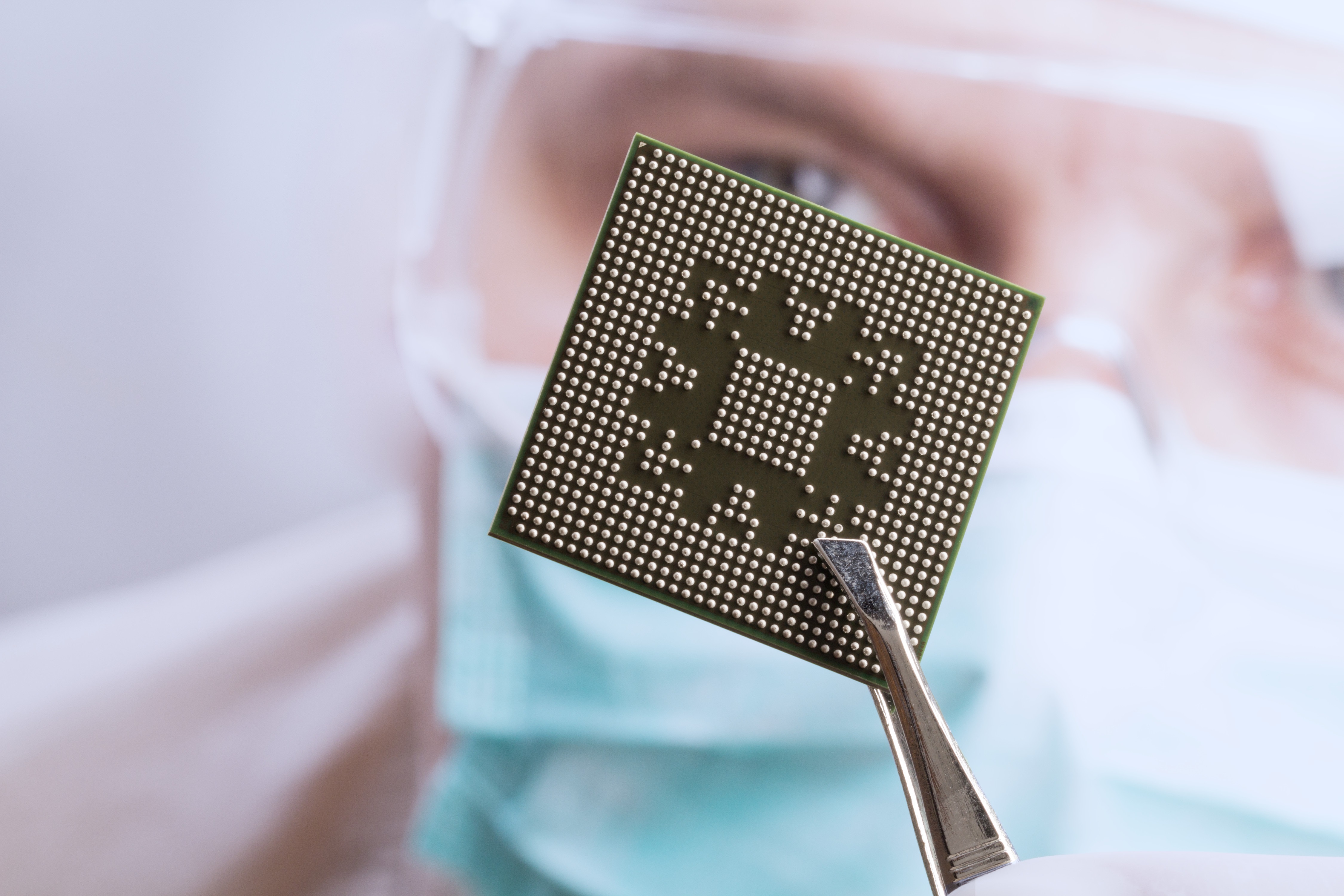 Engineer examining a new integrated circuit