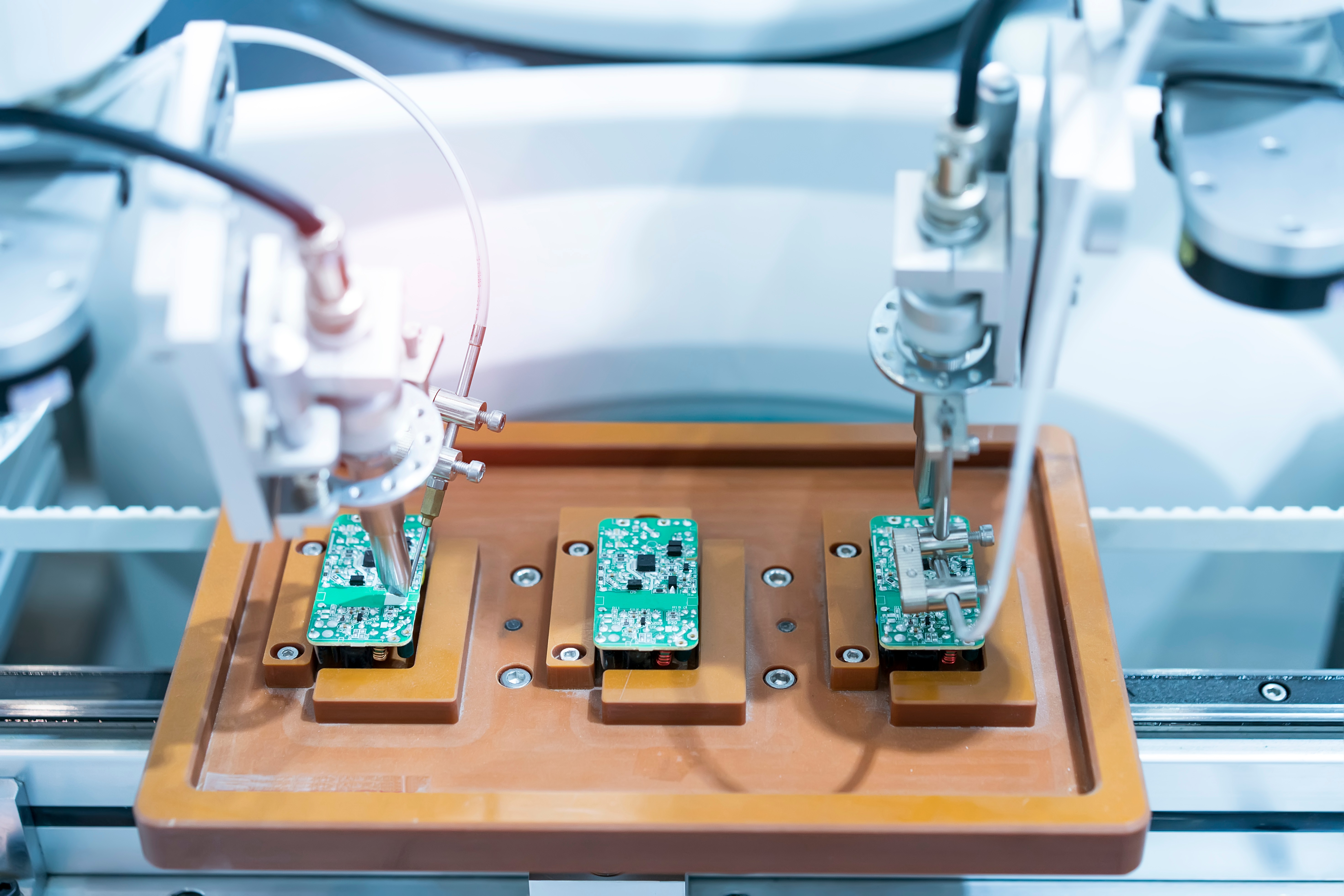 Soldering with a CNC machine, one aspect of the multilayer PCB manufacturing process.