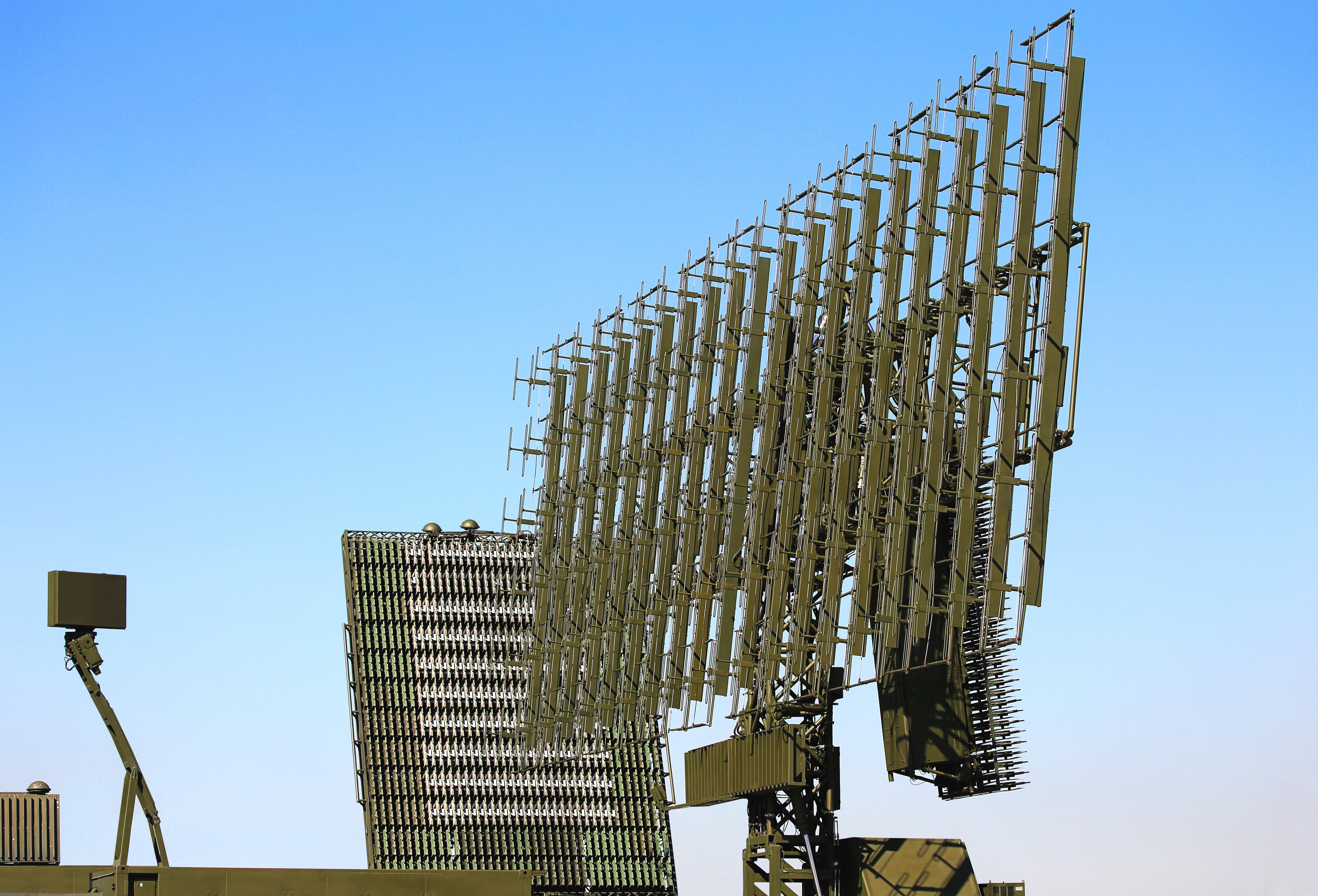 Two phased array antennas against a blue-sky background