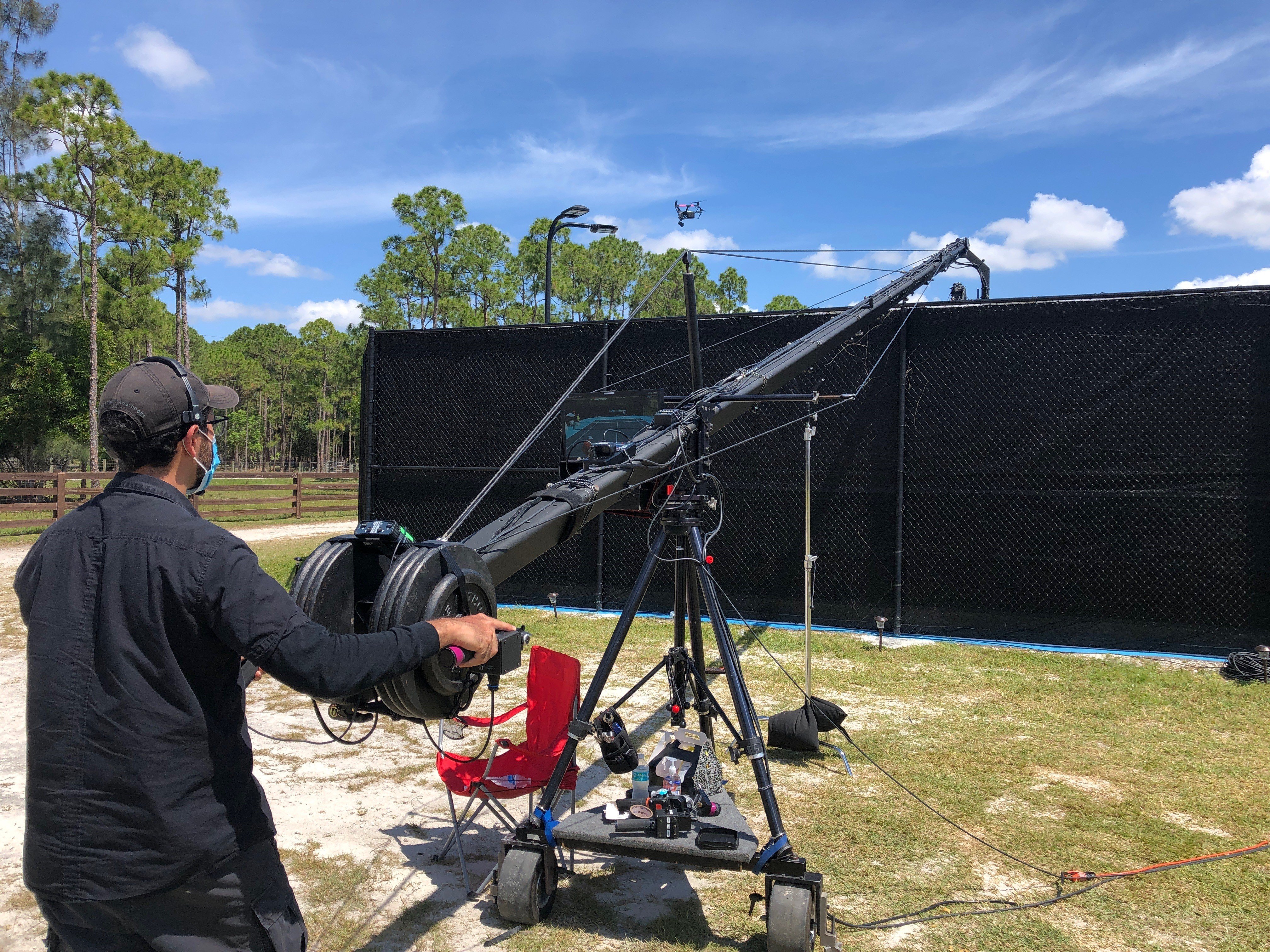 Operator using a jib at tennis event