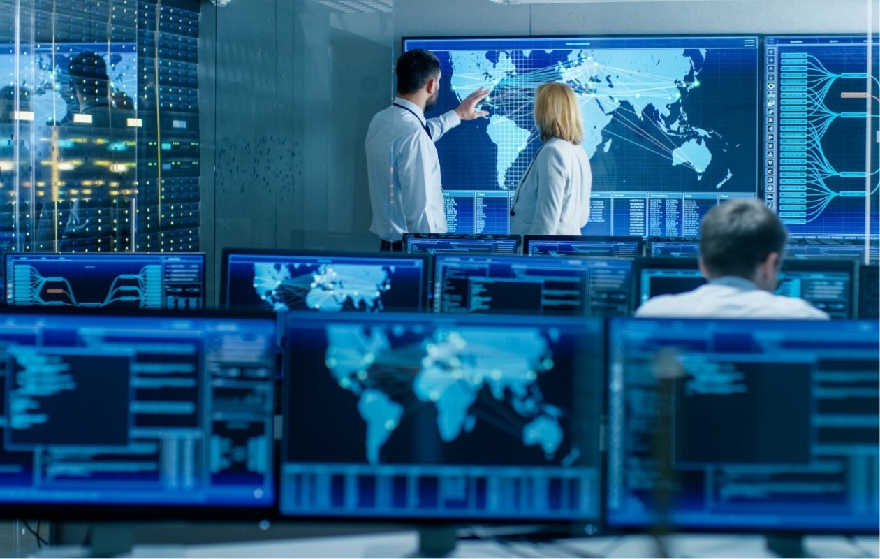 Two people staring at a screen
